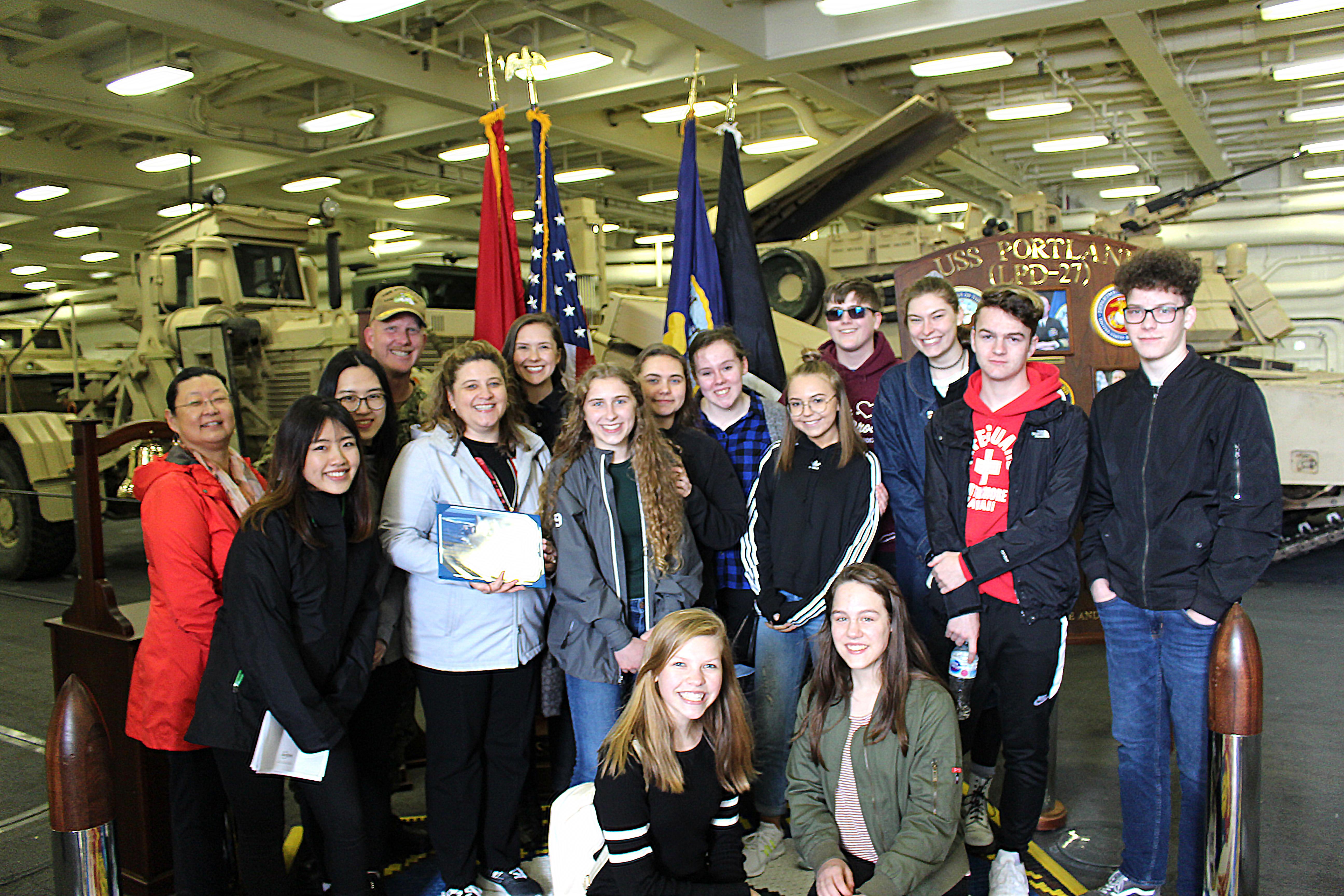 PCS group pose with Captain J.R. Hill of the USS Portland