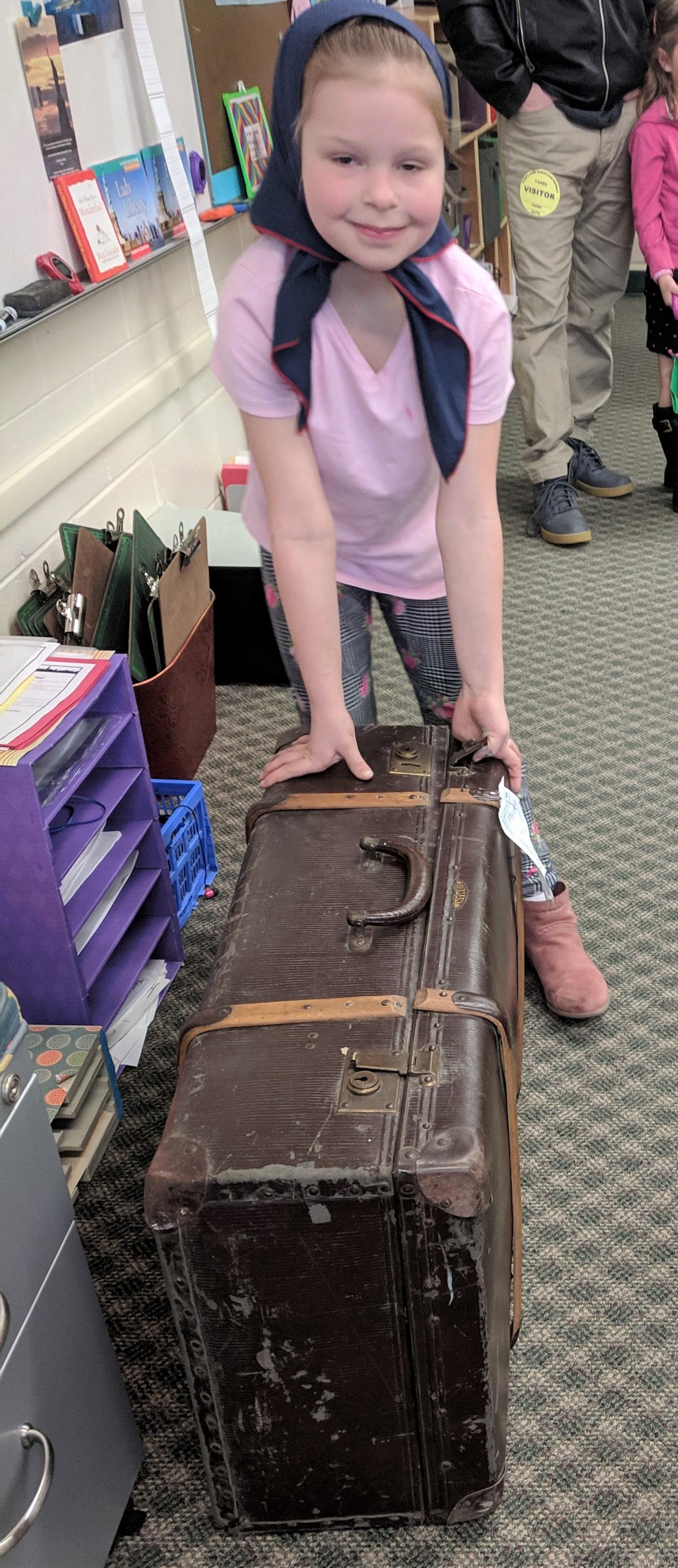 Student with grandfather's trunk.