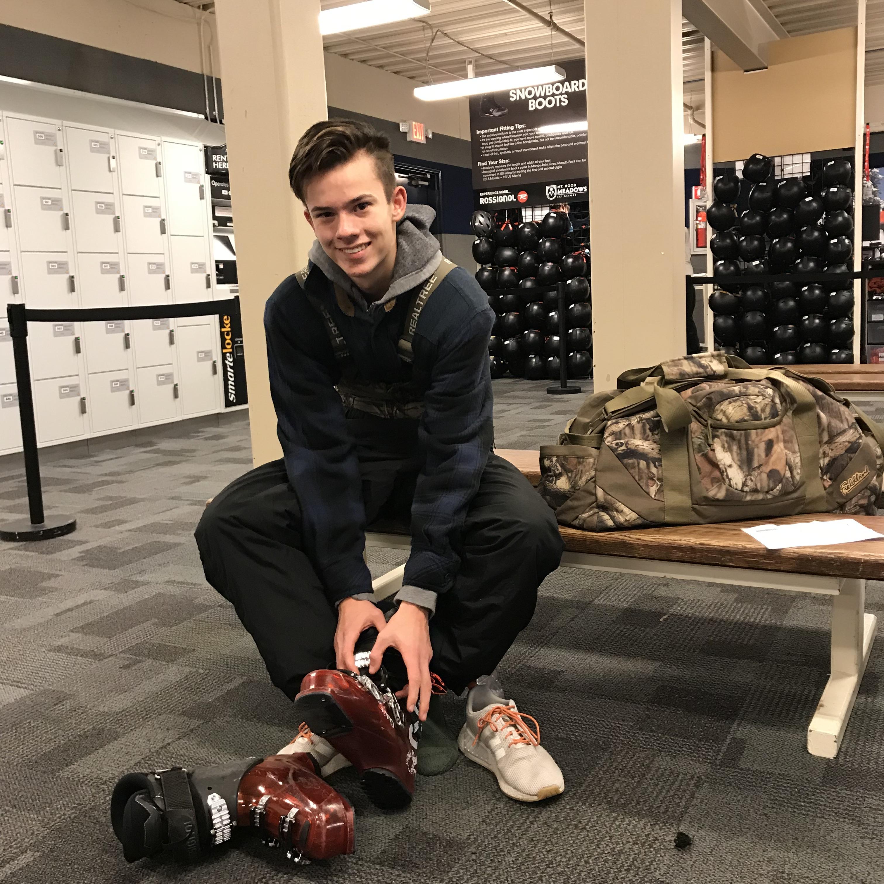 Student getting rental boots