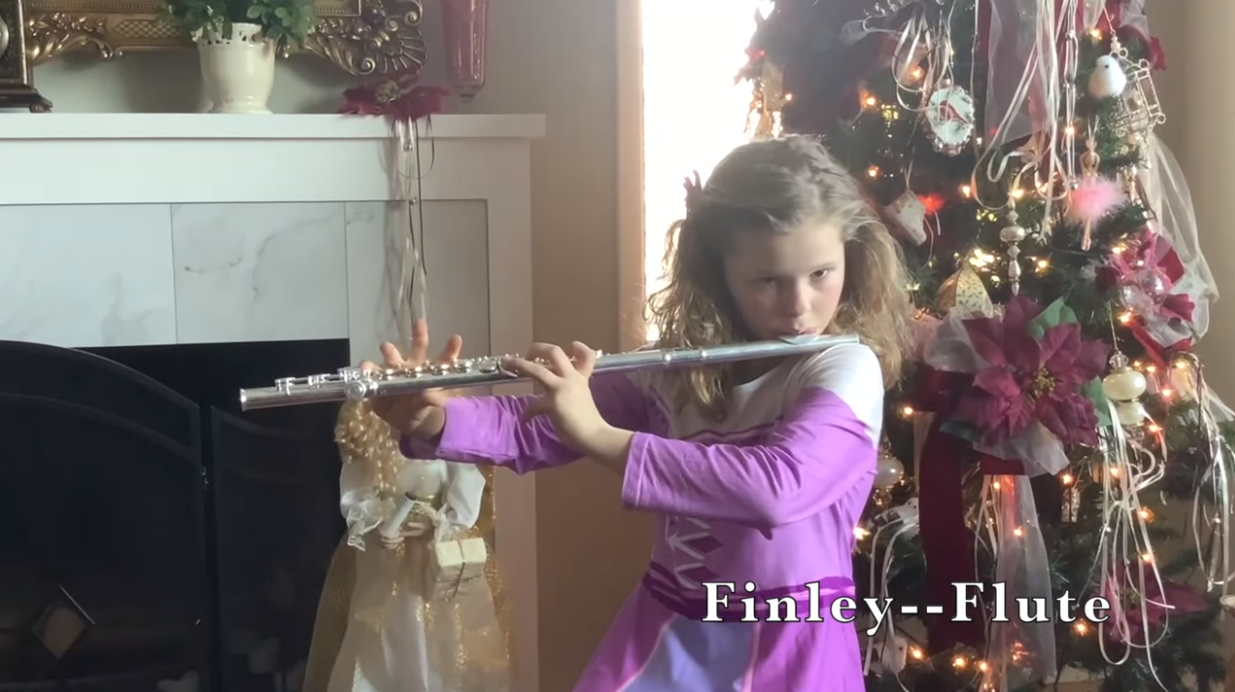 Student at home on flute