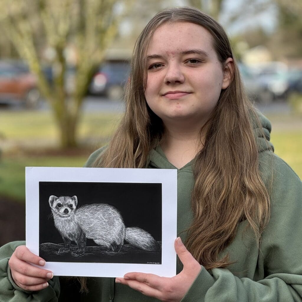 Emmalyn Covey with her piece Dakotan Black-footed Ferret