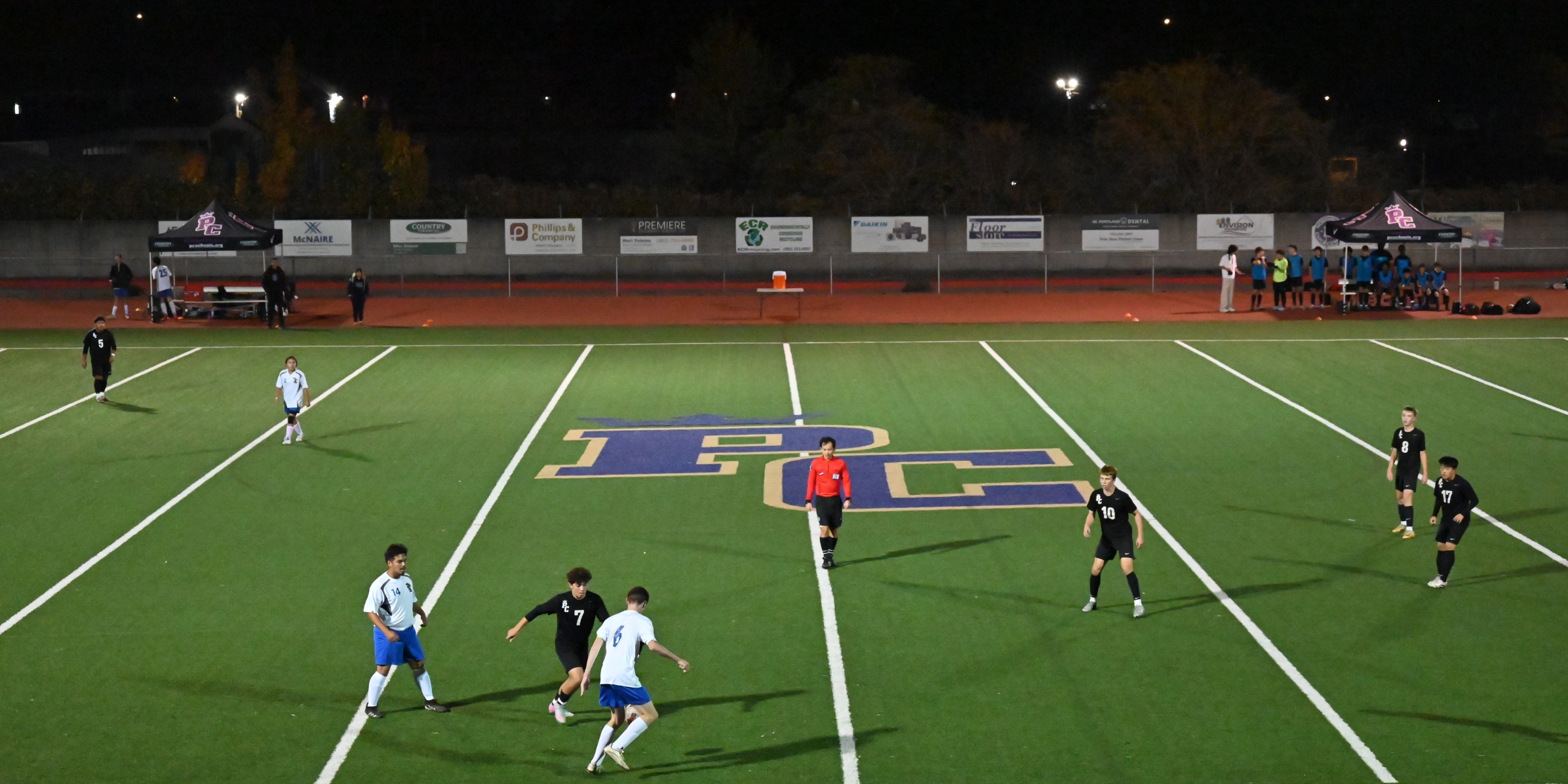 Soccer field with Business Partner Sponsor signs in background
