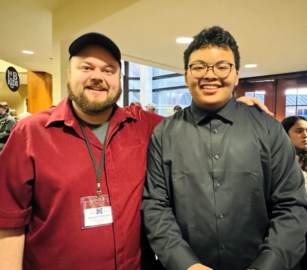 Choir Director Mr. Ostrand and student musician