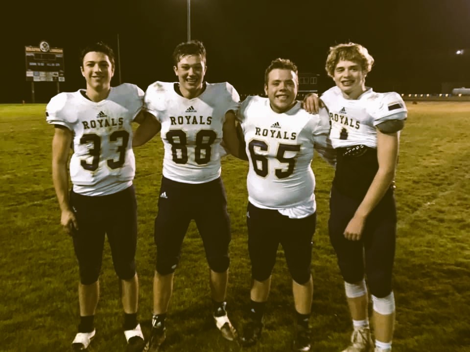 Nolan Helgerson Class of 2021 with football mates